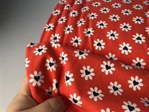 Bomuldsjersey - blomster med hjerte på koral bund